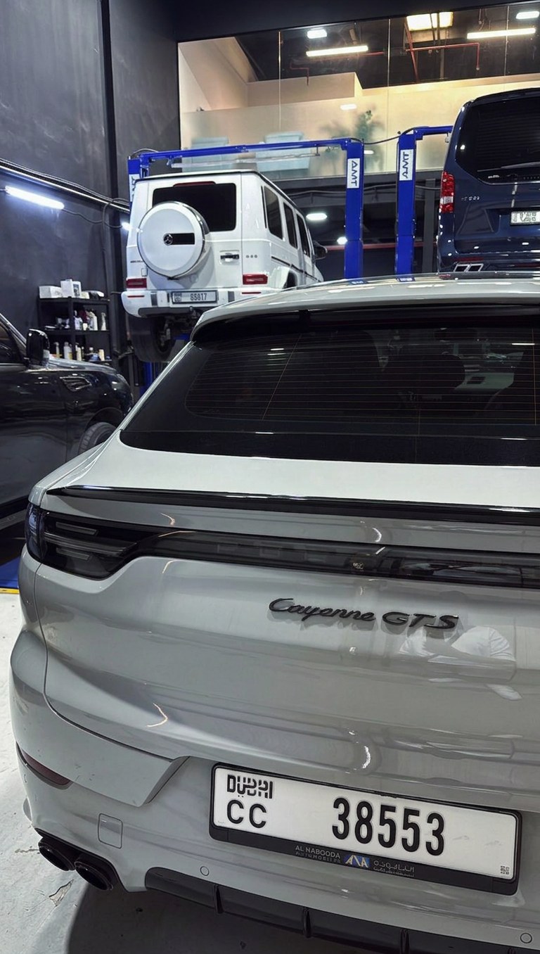 Porsche Cayenne GTS with a Mercedes-AMG G63 on the lift behind at BRITFIX