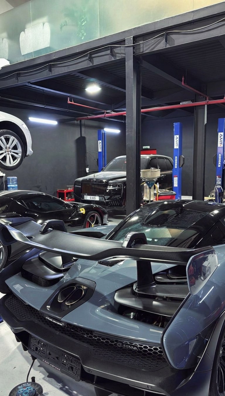 McLaren Senna, Rolls-Royce Cullinan and Ferrari inside the BRITFIX workshop