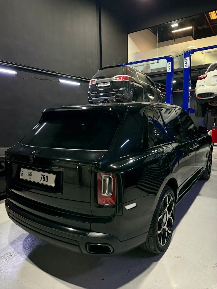 Black Rolls-Royce Cullinan Black Badge inside the BRITFIX Al Quoz workshop
