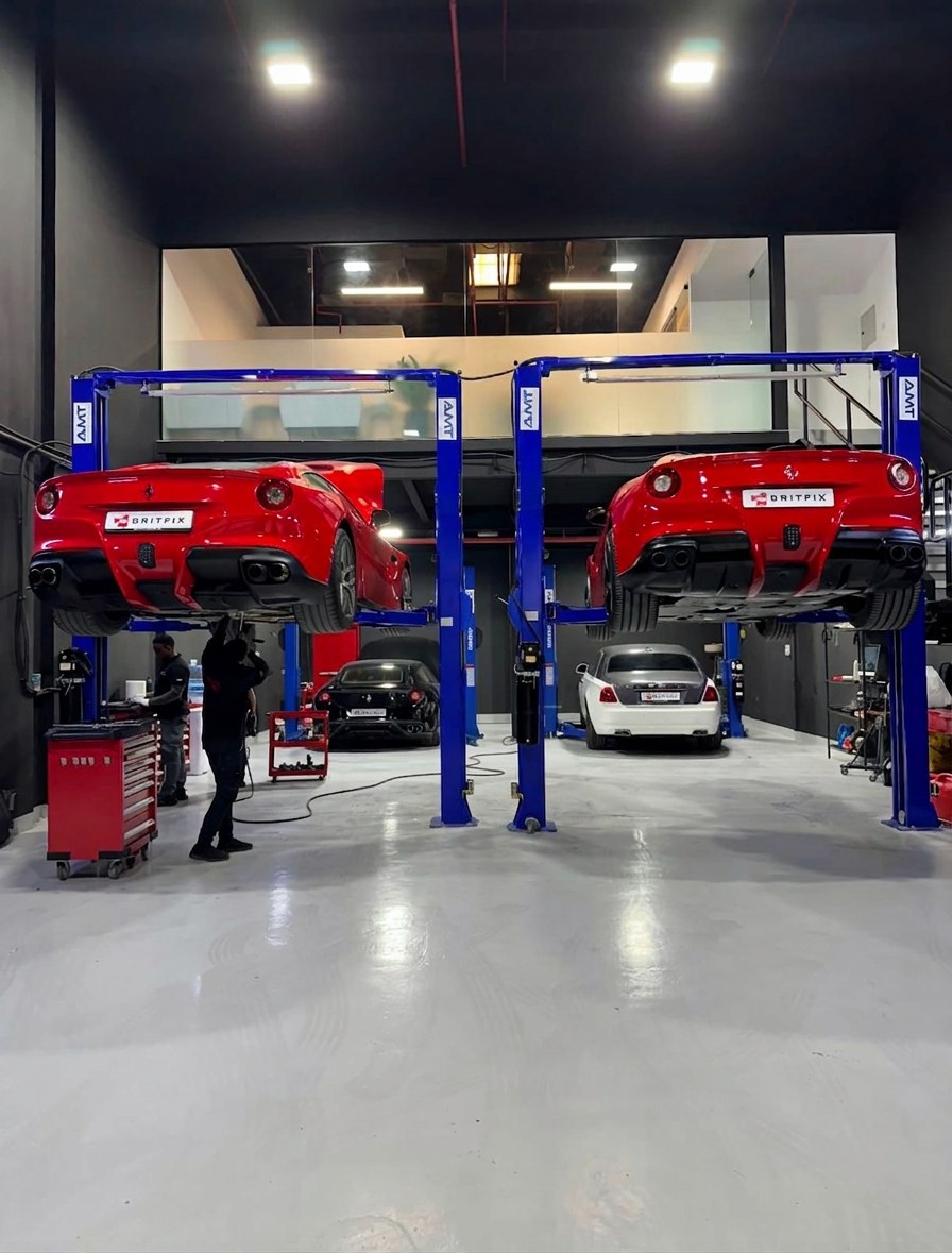 Two Ferrari F12 Berlinettas on BRITFIX ramps for major service